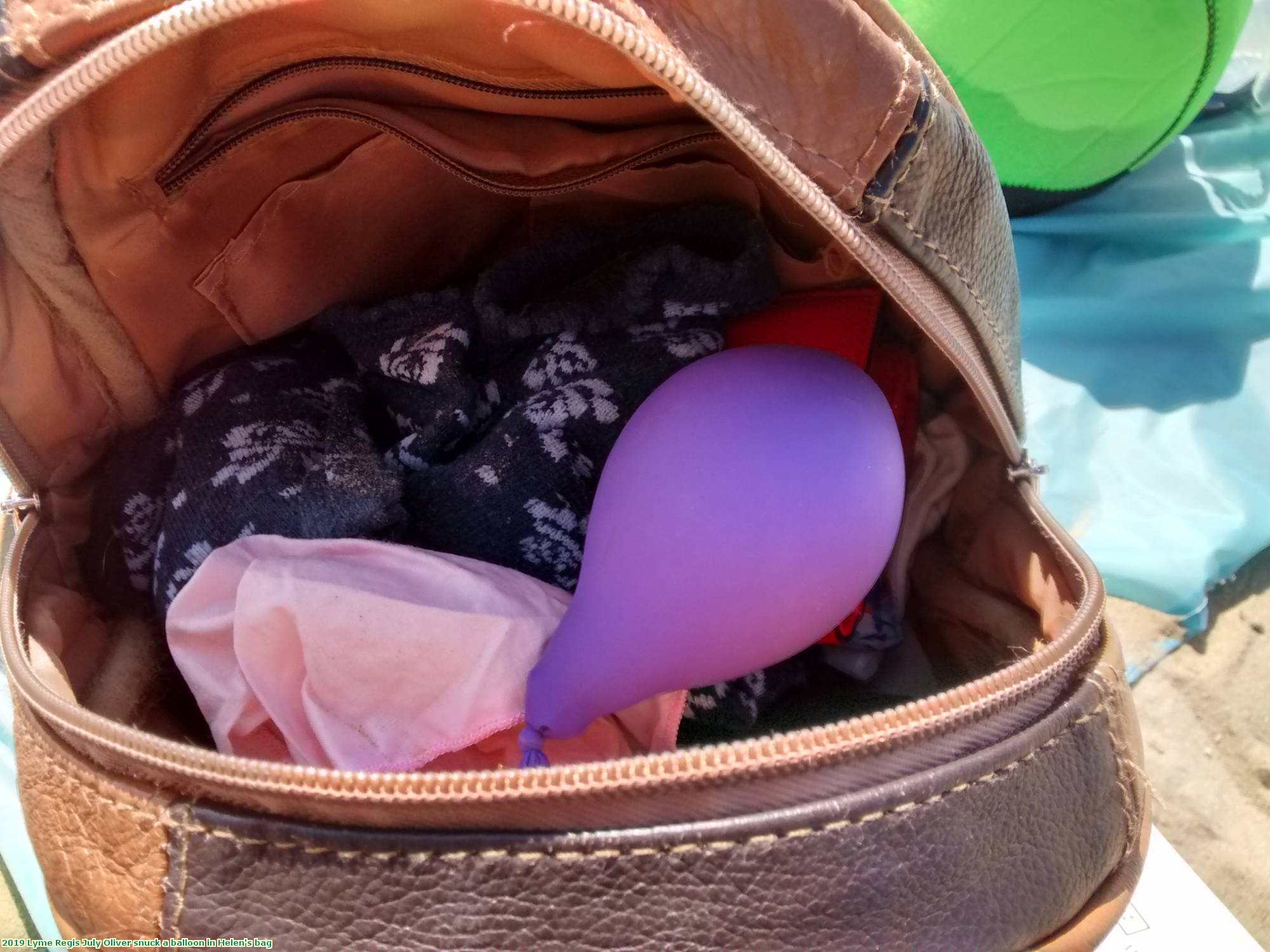 2019 Lyme Regis July Oliver snuck a balloon in Helen's bag