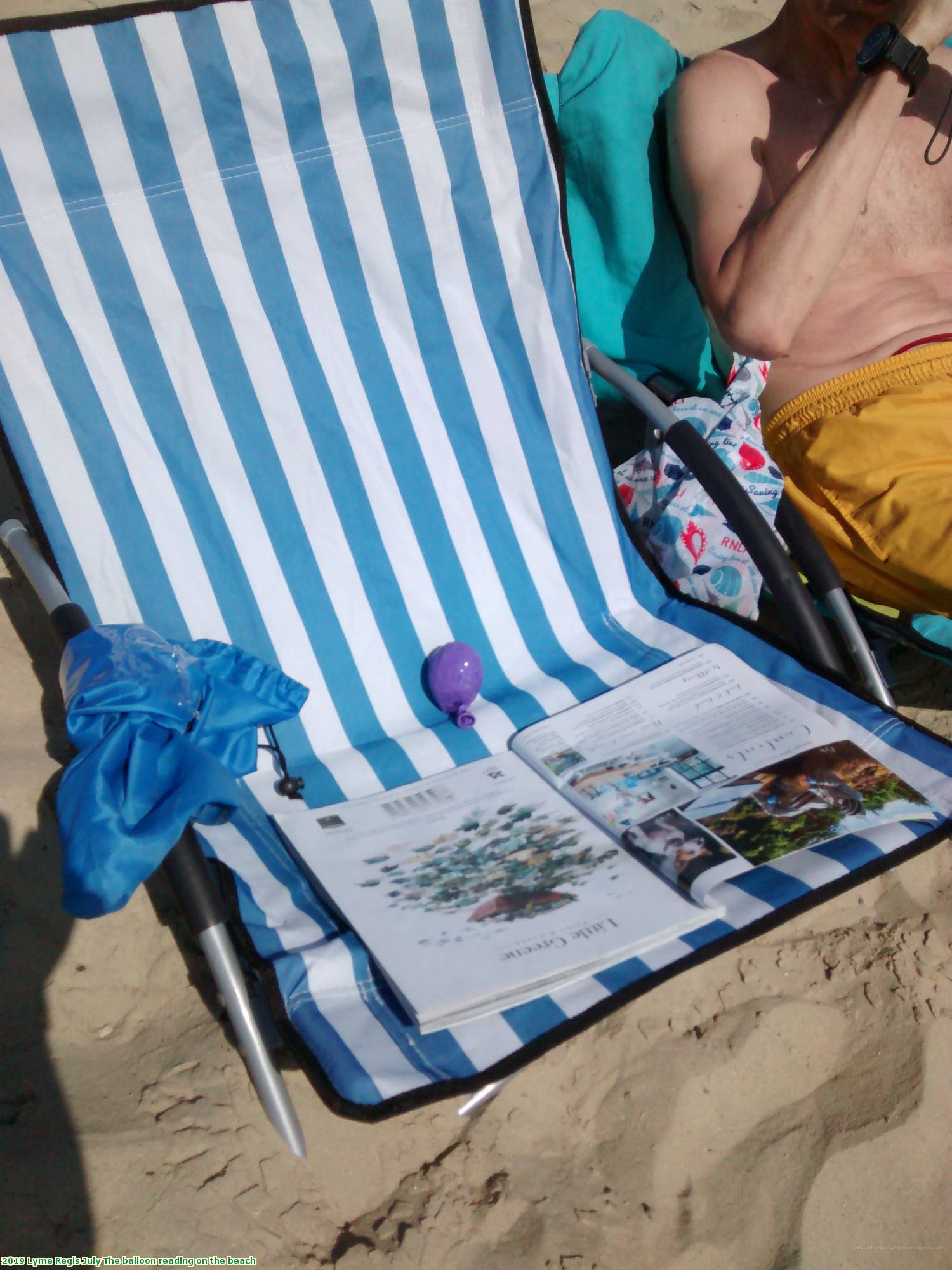 2019 Lyme Regis July The balloon reading on the beach